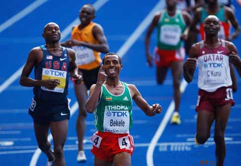 BERLIN - AUGUST 23: Kenenisa Bekele of Ethiopia crosses the line to win the gold medal in the men's 5000 Metres Final during day nine of the 12th IAAF World Athletics Championships at the Olympic Stadium on August 23, 2009 in Berlin, Germany.