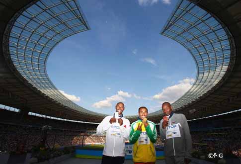 BERLIN: (L-R) Bernard Lagat of United States receives the silver medal, Kenenisa Bekele of Ethiopia the gold medal and James Kwalia C'Kurui of Qatar the bronze medal during the medal ceremony for the men's 5000 Metres Final during day nine of the 12th IAAF World Athletics Championships at the Olympic Stadium on August 23, 2009 in Berlin, Germany.