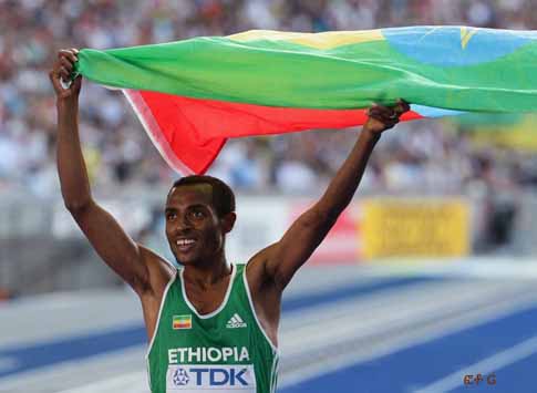 BERLIN - AUGUST 23: Kenenisa Bekele of Ethiopia celebrates winning the gold medal in the men's 5000 Metres Final during day nine of the 12th IAAF World Athletics Championships at the Olympic Stadium on August 23, 2009 in Berlin, Germany.