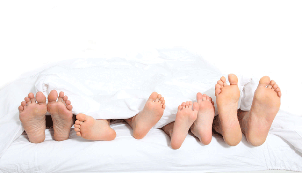 Four people on the same bed