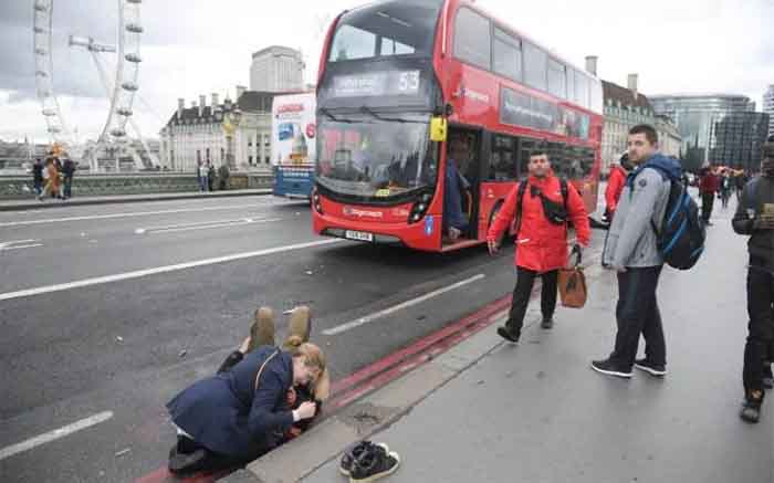A woman assisting an injured person.